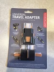 Kikkerland Universal Travel Adapter, Black. Fixed Price $8.00.